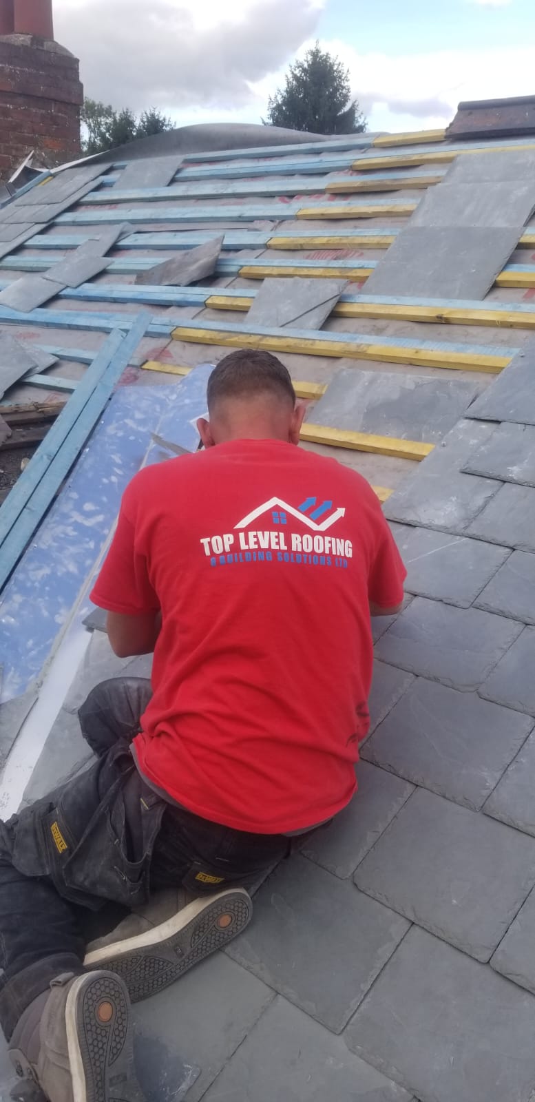 Slate roof being laid by Top Level Roofing & Building Solutions