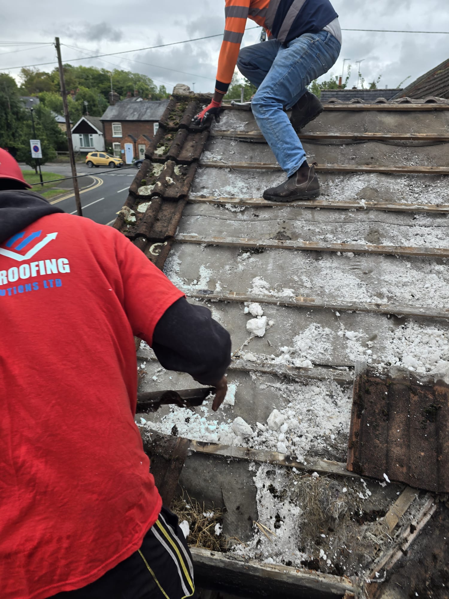 Roof strip and re-roof in progress by Top Level Roofing & Building Solutions
