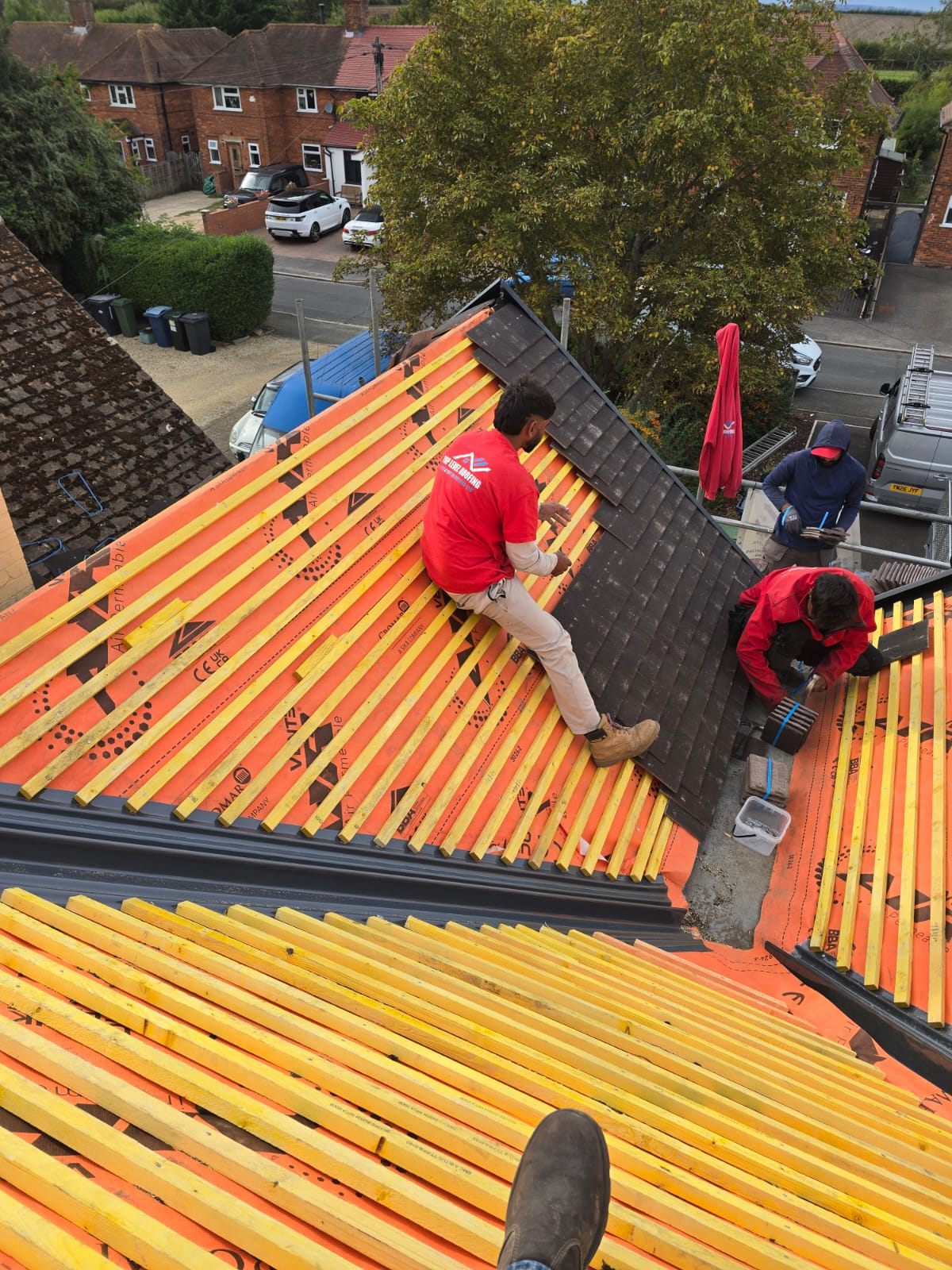 Roofers counter-battening over new membrane during a re-roof by Top Level Roofing & Building Solutions