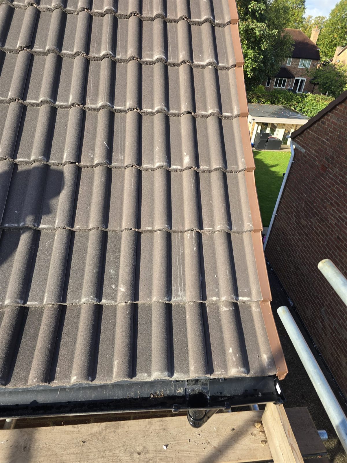 Newly laid interlocking tiles and ridge by Top Level Roofing & Building Solutions