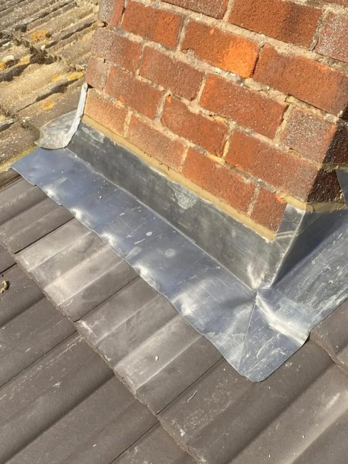 New lead flashing and back gutter around a chimney by Top Level Roofing & Building Solutions