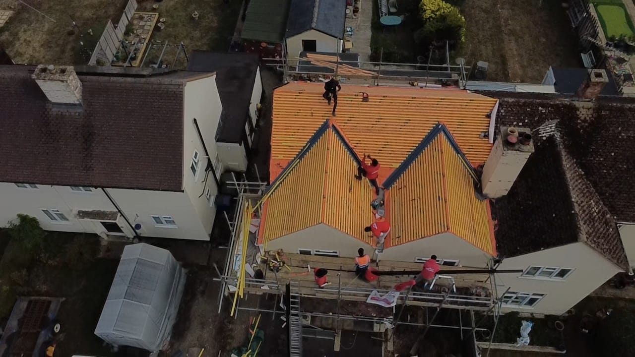 Aerial view of new battens across a double-gable re-roof by Top Level Roofing & Building Solutions